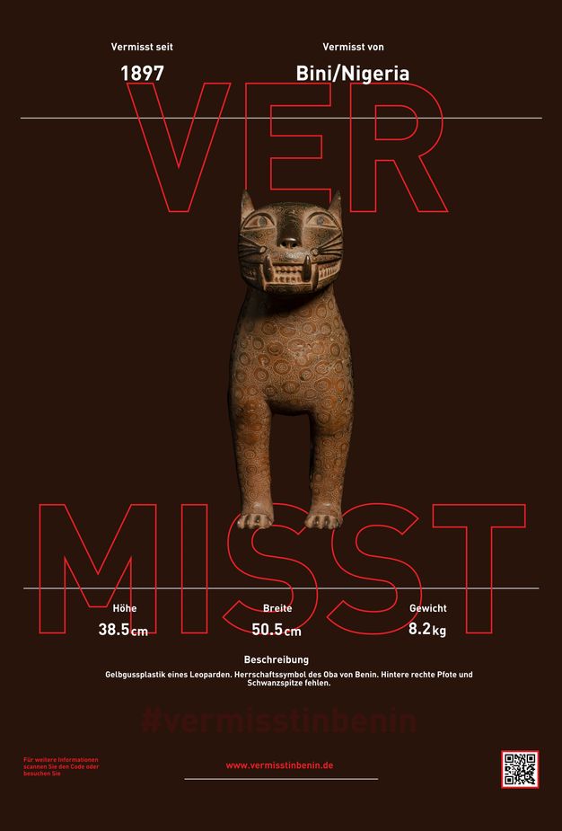 Poster. A sculpture of a stylized cat or lion with fangs bared is at the centre with text above and below. The title of the poster is in large letters outlined in red, and the rest of the text is white against a brown background.