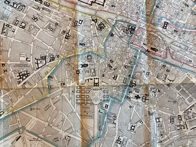 Map. Street view of Paris’s Left Bank. A few streets are outlined in yellow, blue, or pink.