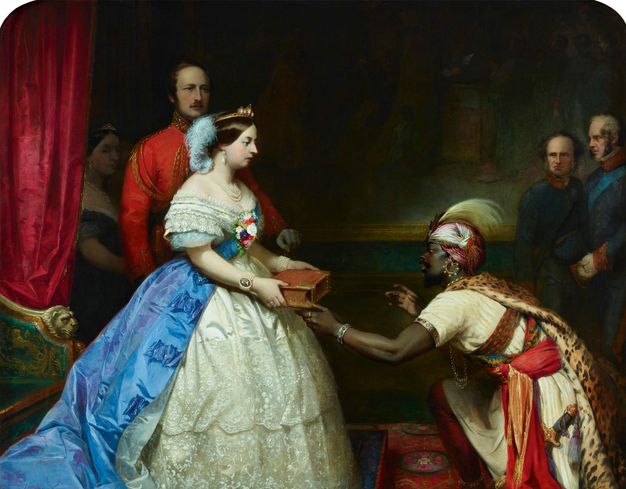 Painting. A woman, Queen Victoria, stands with a thick book in her hands as a dark-skinned Black man kneels and brushes the book with one thumb. Three men, including Prince Albert, and another woman look on from the shadows behind the pair.
