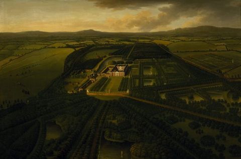 Painting. We look down onto an estate sprawling amid rolling green hills. A lawn stretches in front of a rectangular manor house, and formal gardens are to our right.
