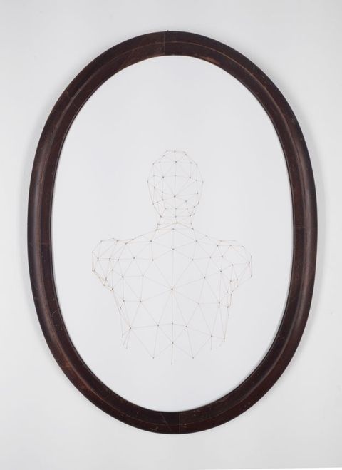 A view of the back of a person from their waist up is drawn with straight lines connecting points to make triangular facets. The white paper is in a black oval frame.