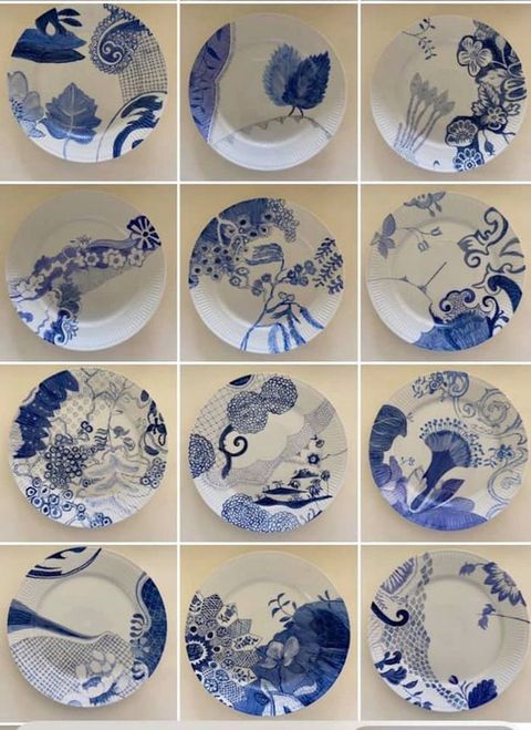 Porcelain. Pictures of twelve white ceramic plates painted with shades of cobalt blue are arranged in a grid. The forms are sinuous and organic, with flowers, vines, and leaves.