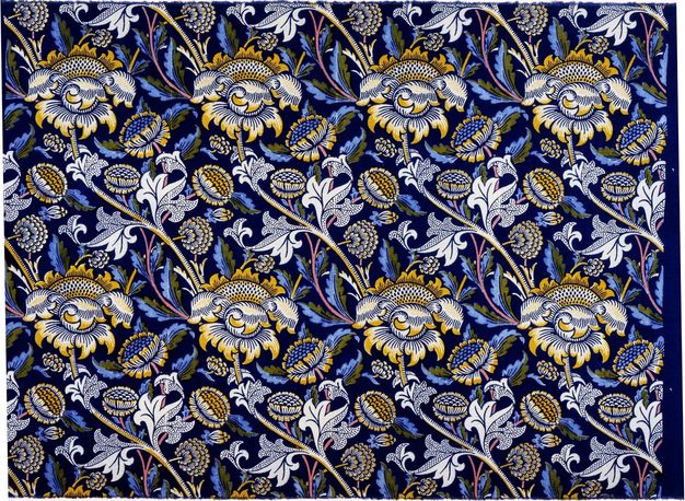 Textile. The stems of blue and yellow, stylized flowers create long, shallow, diagonal S-shapes across this fabric. Leaves are white, blue, and dark olive-green against a black background.
