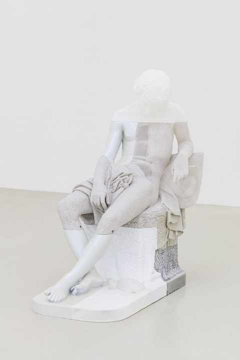 Sculpture. The form of a seated boy with his head dropped forwards in sleep is made in sections of smooth or textured resin in translucent, white, or shades of grey.