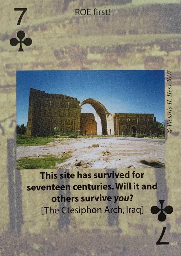 Playing card. A seven of clubs is illustrated with the remains of an arch. Text below it reads, 'This site has survived for seventeen centuries. Will it and others survive you? [The Ctesiphon Arch, Iraq]'.