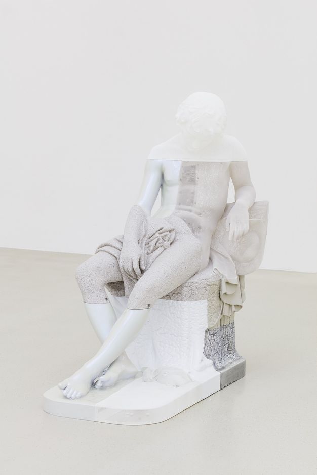 Sculpture. The form of a seated boy with his head dropped forwards in sleep is made in sections of smooth or textured resin in translucent, white, or shades of grey.