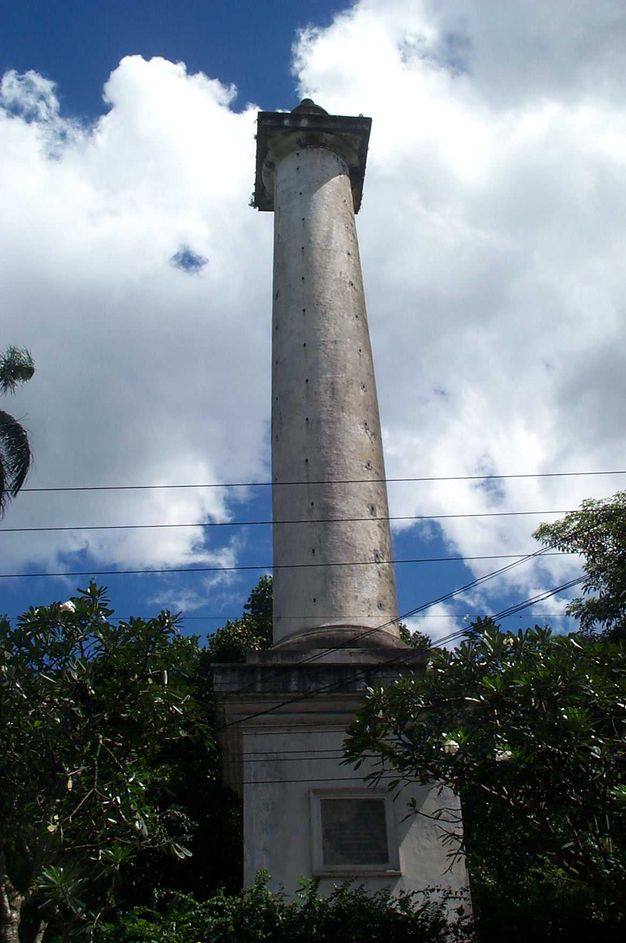 We look up the length of a column a high pedestal. If there is something at the top, it is not visible from this angle.