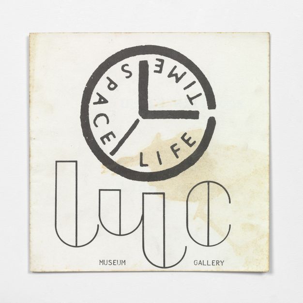 A logo with the words 'LYC Museum and Gallery' appears in an abstracted black font underneath a graphic of a clock. Three hands on the clock separate words at the outer edge, in place of numbers, reading 'TIME', 'SPACE', and 'LIFE', alongside stylised typography.