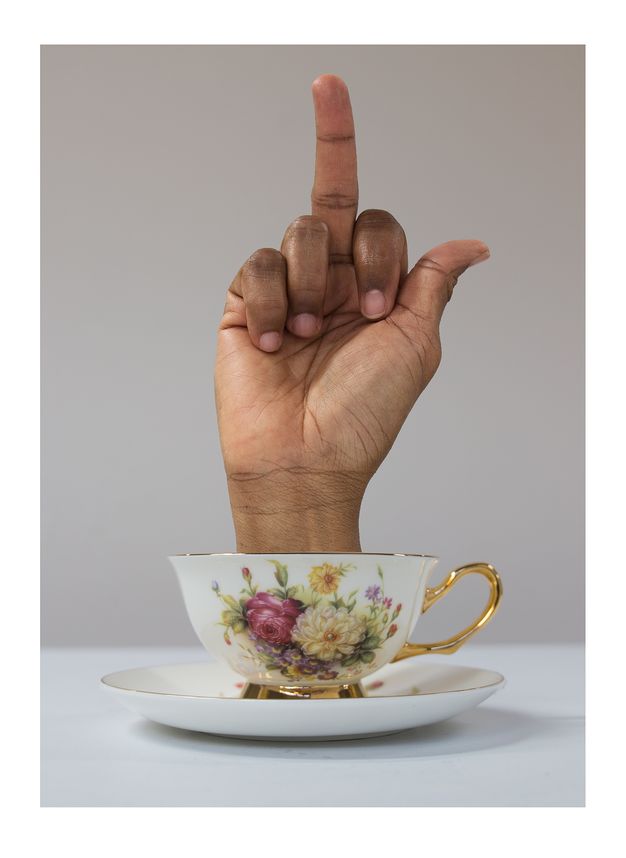 A third variation of the teacup series, where the hand extends its middle finger.
