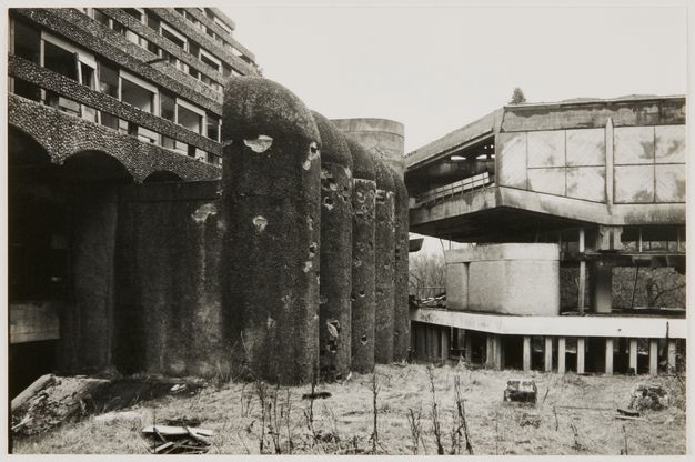 Photograph of the partially demolished and decaying remains of the Tricorn Centre in Portsmouth, showing exposed concrete, rounded columns, and remnants of Brutalist architectural elements.