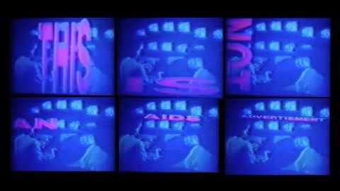 Video stills. Six television monitors arranged in a grid of 3 x 2. Each monitor shows a still of a film, each featuring a word. Together they read: \"This is not an AIDS advertisement\".