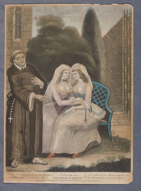 Black and white photograph. Two women wearing full nuns’ habits stand side by side in a secluded garden, holding a bible together. The nun on the right looks suggestively at her companion, and reaches out a hand towards her. The nun on the right has clasped hands and stares down at the bible. In the background are plants and historic stone features.