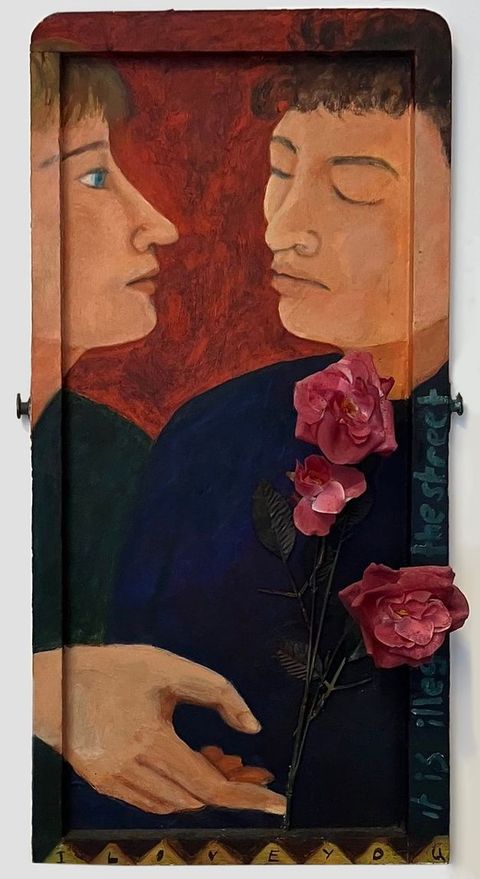Painting. Two people are closely cropped to show only their faces and shoulders, which they lean towards one another. One has their head raised and eyes open, while the other closes their eyes. Against the backdrop of their dark clothing a hand emerges, holding out a stem of roses. The painting expands onto the frame, and on one part of it are the words, “it is illegal on the street”.