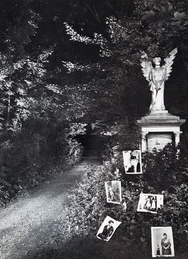 Black and white photograph. Road winds across a woodland area at night with a carved, slightly aged marble statue of a winged angel on the right side. Five photographs nestled in foliage showing various people.