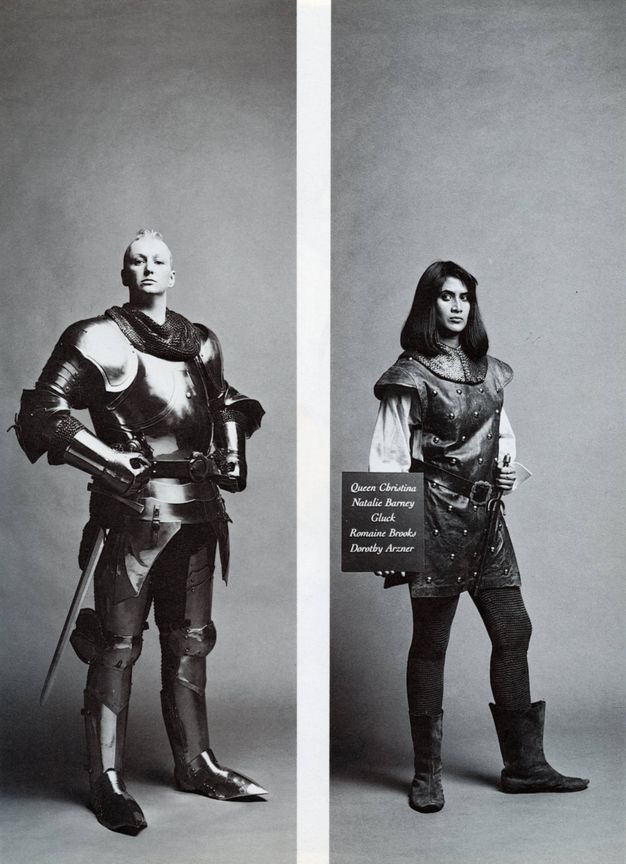 Two black and white photographs. Man with light hair standing in suit of gleaming armour with sword, hands resting at 45-degree angles on his waist. Right photograph showing South Asian woman dressed in loose studded leather tunic with billowing sleeves and belt, she holds a dagger and board with names listed, her left boot is turned out.