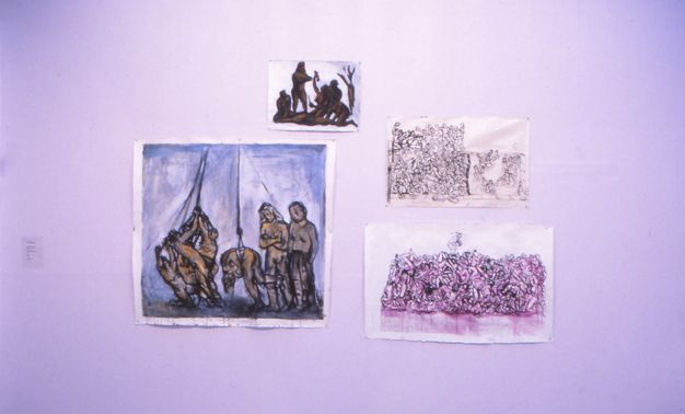 Installation. Four sketches in various mediums are assembled on a white surface. Each of the sketches depicts multiple piled, heaped and writhing bodies.