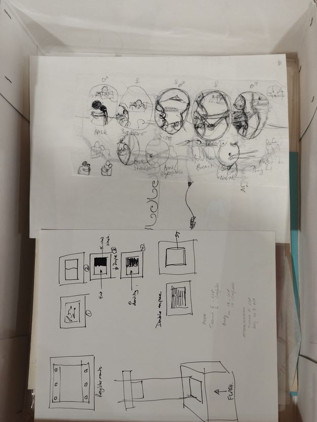 Digital facsimile. Loose sheets of thin, semi-translucent paper containing a series of hand-drawn sketches and written notes in black ink are stacked together into a storage box. The drawings are diagrammatical in style, describing various three-dimensional designs and ideas.