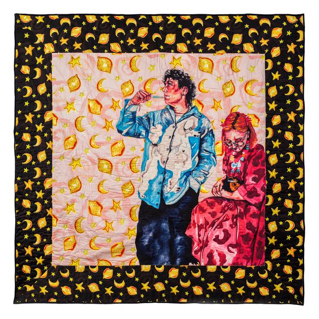 Colour photograph. In this mixed media artwork, the artist incorporates elements of digital printing, embroidery and quilting to describe two people dressed in blue and pink clothing against a patterned backdrop featuring lemons, moons and stars. One person stands, while the other is seated.