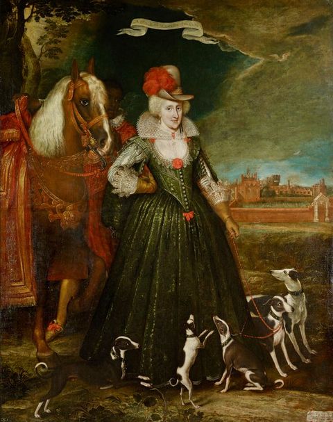 Painting. A colourful painting of a woman from head to toe, wearing a long green dress, standing in an outdoor space. A tumultuous sky is visible to the right of the image. On her left, a decorated horse is partially seen. At her feet on the right a group of five small dogs playfully interact with one another. 