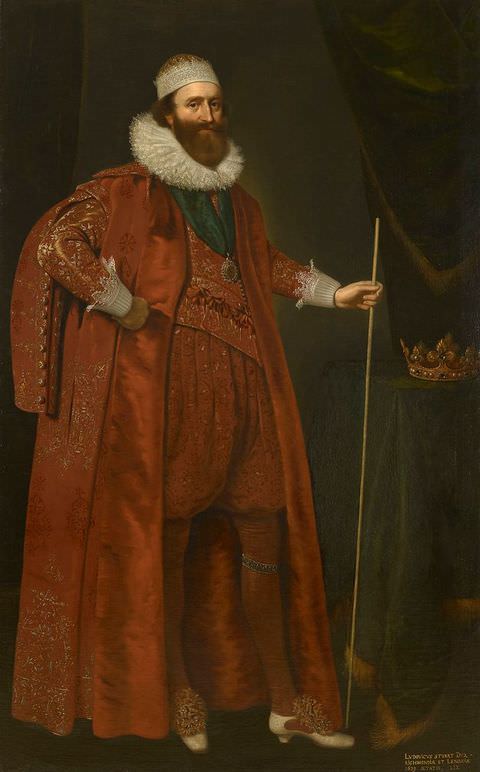 Painting. A full-length portrait of a man dressed in indulgent red clothing, including knee-length pantaloons, a cape, and tights. Around his neck is a stiff white collar, while on his head he wears a white crown with a red centre. Behind the man an interior space is visible, decorated with thick, dark green curtains. On the right, a gold crown sits on a table covered by a green blanket.