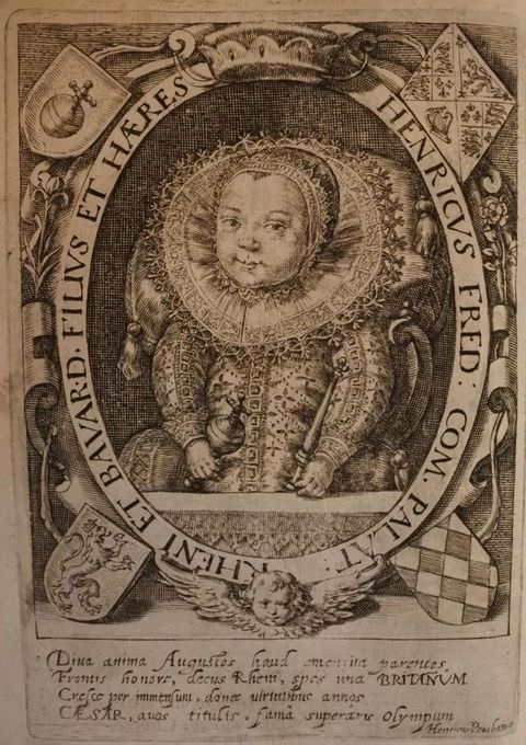 Print. This book page features a sepia-tinted illustration of a baby dressed in elaborate clothing including an embroidered collar and bonnet. The child is contained within an oval frame which bears a passage of text, and a crown at the top centre. A series of shields are propped onto against each corner. Below is a small passage of text.