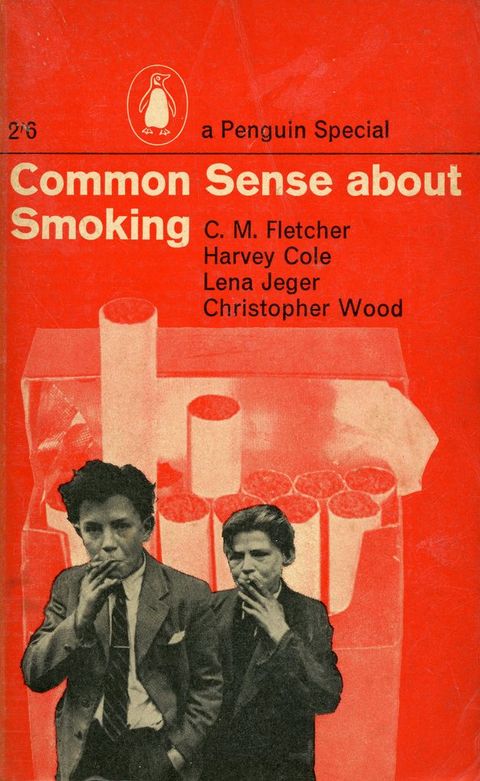 Colour photograph. This bright red book cover features the title, 'Common Sense About Smoking', along with a black and white cutout of two young teenage boys wearing suits and smoking cigarettes. Behind them is a white printed digital image of an open cigarette packet.