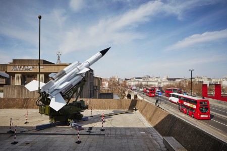 Installation view of <i>Ferranti International plc, British Aircraft Corporation Bloodhound Mark 2 Surface-to-Air Missile and Launcher, Guided Missile, Type 202, c. 1965-66</i>. Missile: aluminium, magnesium alloy, stainless steel, wood, resin embossed fabric; launcher: steel. RAF Air Defence Radar Museum. Hayward Gallery, London, 10 February – 26 April 2015